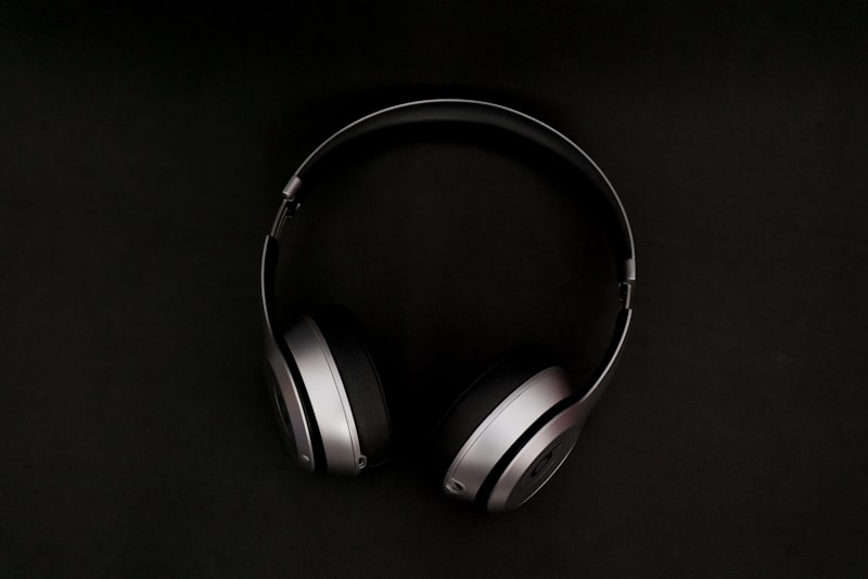 Headphones beside an audio equalizer interface