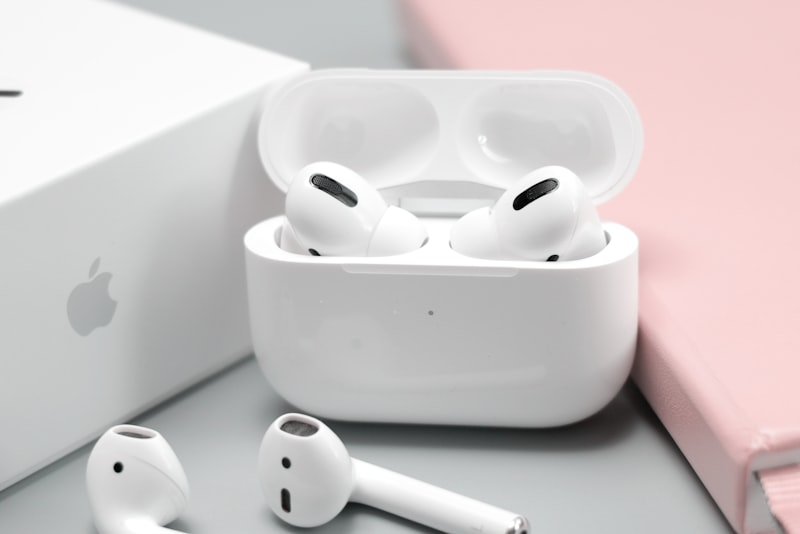 Over-ear headphones next to wireless earbuds